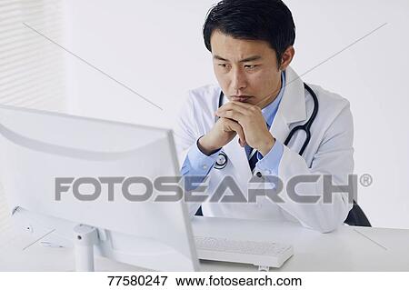 Japanese doctor in his studio View Large Photo Image Stock Photo - Japanese doctor in his studio. Fotosearch