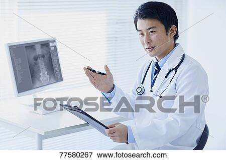 Stock Photo - Japanese doctor in his studio. Fotosearch