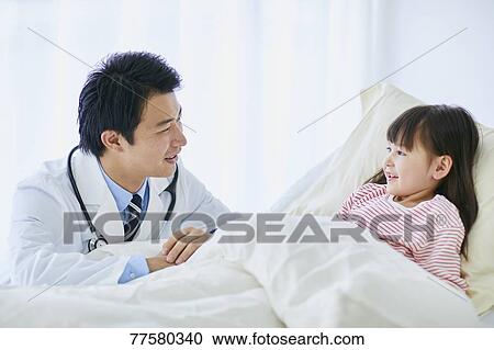 Japanese doctor with a patient in bed View Large Photo Image Stock Image - Japanese doctor with a patient in bed. Fotosearch