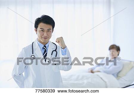 Japanese doctor with a patient in bed View Large Photo Image Stock Photo - Japanese doctor with a patient in bed. Fotosearch