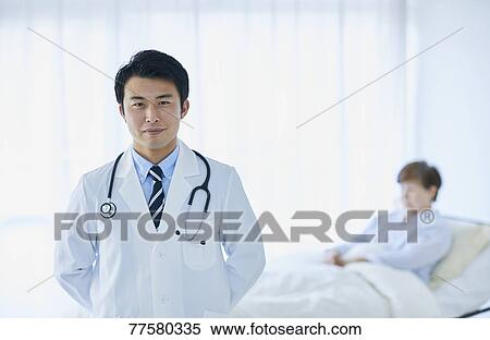 Japanese doctor with a patient in bed View Large Photo Image Stock Photography - Japanese doctor with a patient in bed. Fotosearch