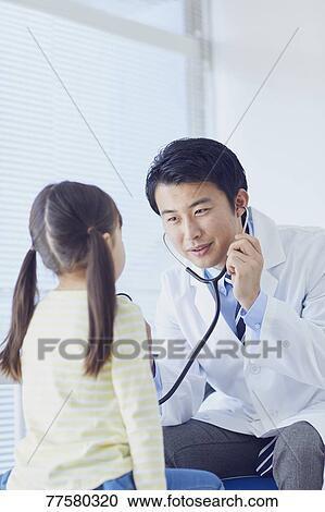 Japanese doctor with a patient in his studio View Large Photo Image Stock Image - Japanese doctor with a patient in his studio. Fotosearch