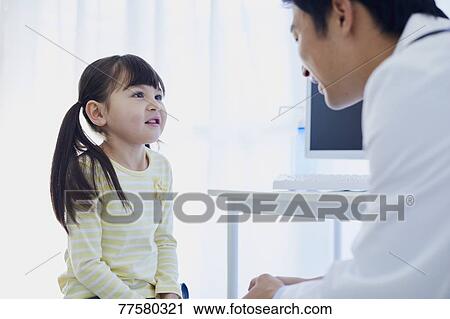 Japanese doctor with a patient in his studio View Large Photo Image Stock Image - Japanese doctor with a patient in his studio. Fotosearch