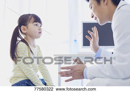 Japanese doctor with a patient in his studio View Large Photo Image Stock Image - Japanese doctor with a patient in his studio. Fotosearch