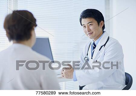 Japanese doctor with a patient in his studio View Large Photo Image Stock Photo - Japanese doctor with a patient in his studio. Fotosearch
