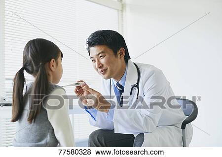 Japanese doctor with a patient in his studio View Large Photo Image Stock Photo - Japanese doctor with a patient in his studio. Fotosearch