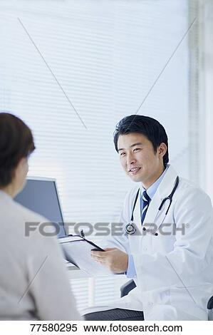 Japanese doctor with a patient in his studio View Large Photo Image Stock Photography - Japanese doctor with a patient in his studio. Fotosearch