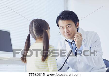 Japanese doctor with a patient in his studio View Large Photo Image Stock Photography - Japanese doctor with a patient in his studio. Fotosearch