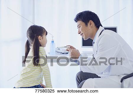 Japanese doctor with a patient in his studio View Large Photo Image Stock Photography - Japanese doctor with a patient in his studio. Fotosearch