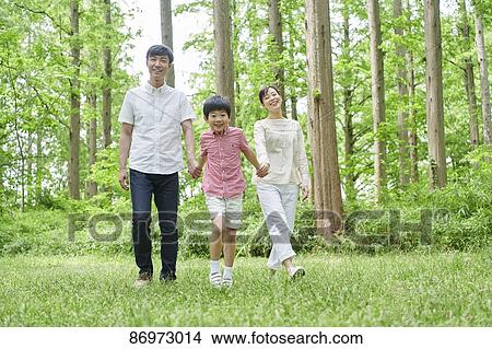 Japanese family in a city park View Large Photo Image Picture - Japanese family in a city park. Fotosearch