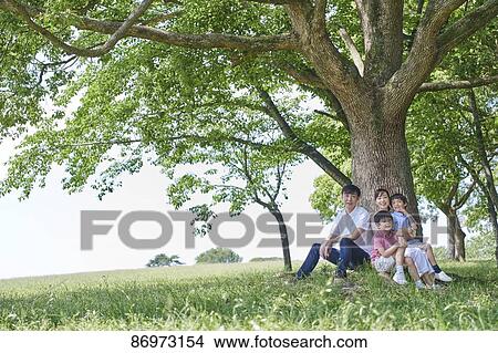Japanese family in a city park View Large Photo Image Picture - Japanese family in a city park. Fotosearch