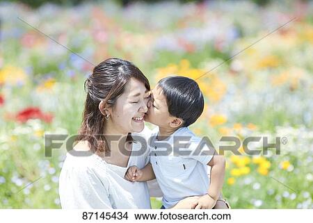 Picture - Japanese family in a city park. Fotosearch