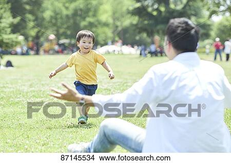 Japanese family in a city park View Large Photo Image Picture - Japanese family in a city park. Fotosearch