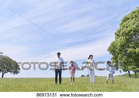 Japanese family in a city park View Large Photo Image Stock Image - Japanese family in a city park. Fotosearch