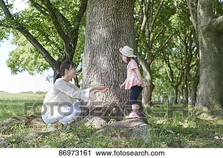 Japanese family in a city park View Large Photo Image Stock Image - Japanese family in a city park. Fotosearch