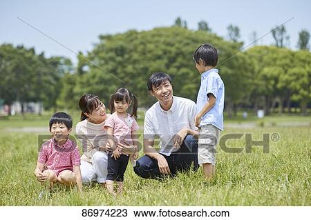 Japanese family in a city park View Large Photo Image Stock Image - Japanese family in a city park. Fotosearch