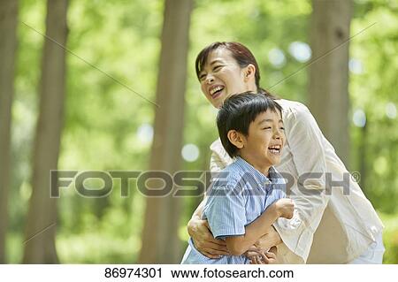 Japanese family in a city park View Large Photo Image Stock Image - Japanese family in a city park. Fotosearch