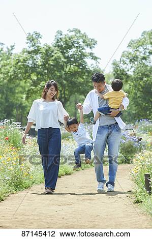 Japanese family in a city park View Large Photo Image Stock Image - Japanese family in a city park. Fotosearch