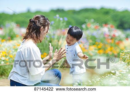 Japanese family in a city park View Large Photo Image Stock Image - Japanese family in a city park. Fotosearch