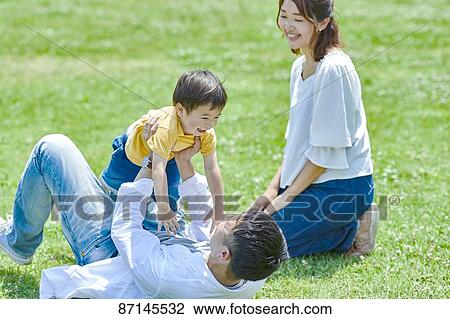 Japanese family in a city park View Large Photo Image Stock Image - Japanese family in a city park. Fotosearch