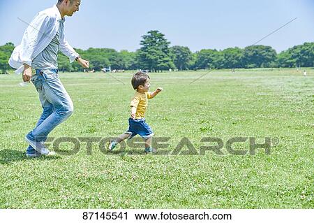 Japanese family in a city park View Large Photo Image Stock Image - Japanese family in a city park. Fotosearch