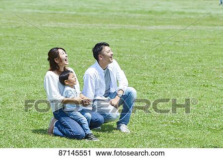 Japanese family in a city park View Large Photo Image Stock Image - Japanese family in a city park. Fotosearch