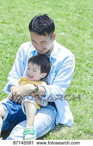 Japanese family in a city park View Large Photo Image Stock Image - Japanese family in a city park. Fotosearch