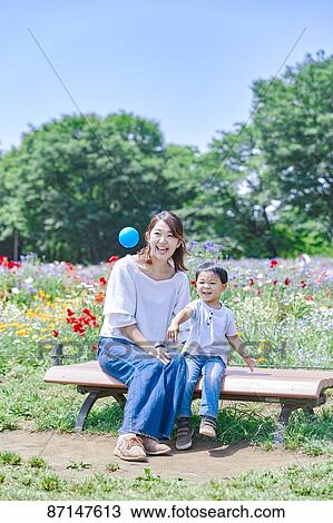 Japanese family in a city park View Large Photo Image Stock Image - Japanese family in a city park. Fotosearch
