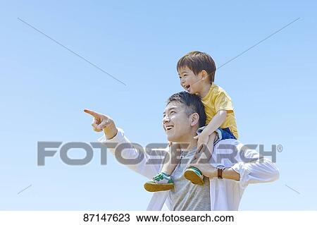 Japanese family in a city park View Large Photo Image Stock Image - Japanese family in a city park. Fotosearch