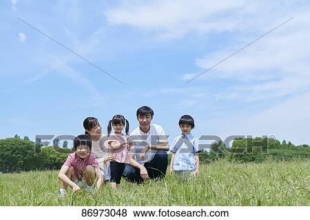 Japanese family in a city park View Large Photo Image Stock Photo - Japanese family in a city park. Fotosearch