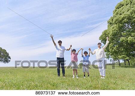 Japanese family in a city park View Large Photo Image Stock Photo - Japanese family in a city park. Fotosearch