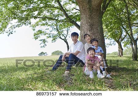 Japanese family in a city park View Large Photo Image Stock Photo - Japanese family in a city park. Fotosearch