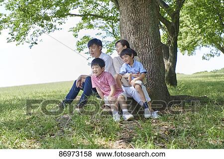 Japanese family in a city park View Large Photo Image Stock Photo - Japanese family in a city park. Fotosearch