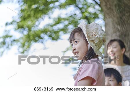Japanese family in a city park View Large Photo Image Stock Photo - Japanese family in a city park. Fotosearch