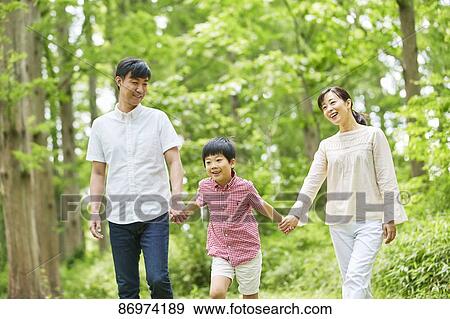 Japanese family in a city park View Large Photo Image Stock Photo - Japanese family in a city park. Fotosearch