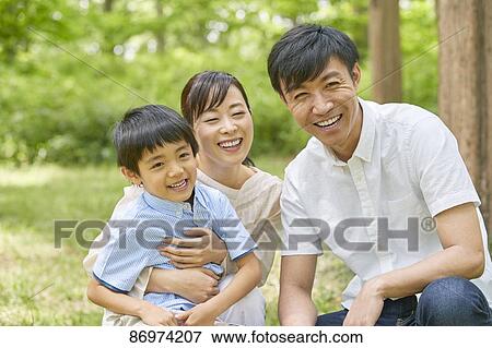 Japanese family in a city park View Large Photo Image Stock Photo - Japanese family in a city park. Fotosearch