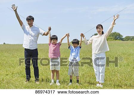 Japanese family in a city park View Large Photo Image Stock Photo - Japanese family in a city park. Fotosearch