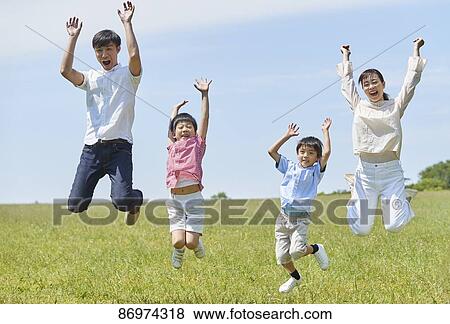 Stock Photo - Japanese family in a city park. Fotosearch