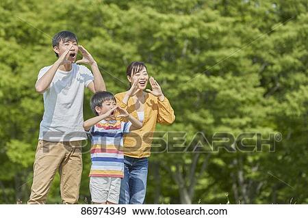 Stock Photo - Japanese family in a city park. Fotosearch