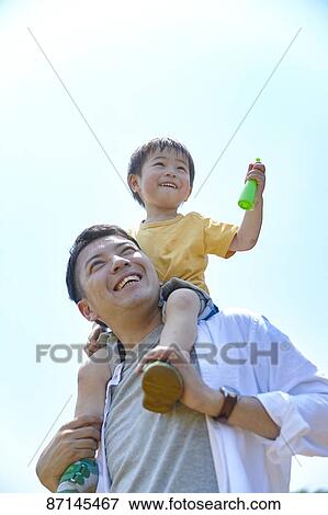 Japanese family in a city park View Large Photo Image Stock Photo - Japanese family in a city park. Fotosearch