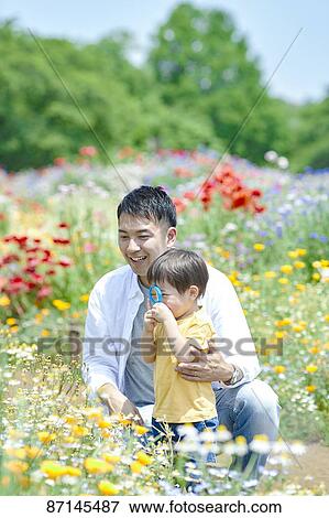 Stock Photo - Japanese family in a city park. Fotosearch