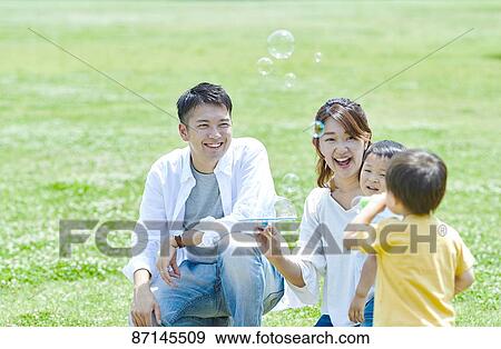 Japanese family in a city park View Large Photo Image Stock Photo - Japanese family in a city park. Fotosearch