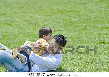 Japanese family in a city park View Large Photo Image Stock Photo - Japanese family in a city park. Fotosearch