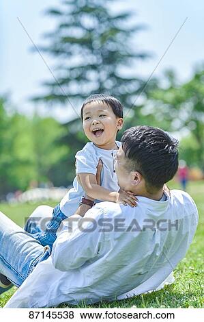 Japanese family in a city park View Large Photo Image Stock Photo - Japanese family in a city park. Fotosearch