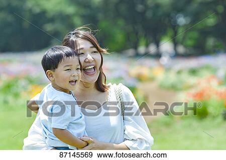 Japanese family in a city park View Large Photo Image Stock Photo - Japanese family in a city park. Fotosearch