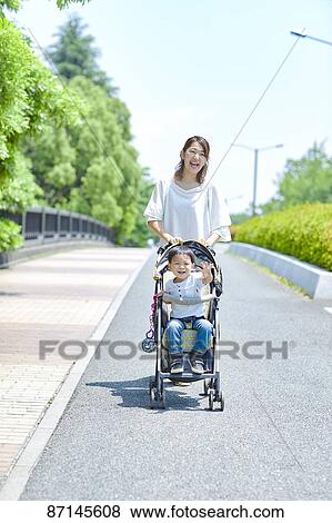 Japanese family in a city park View Large Photo Image Stock Photo - Japanese family in a city park. Fotosearch