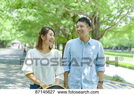 Japanese family in a city park View Large Photo Image Stock Photo - Japanese family in a city park. Fotosearch