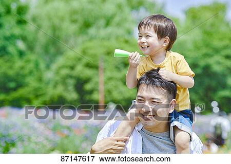 Japanese family in a city park View Large Photo Image Stock Photo - Japanese family in a city park. Fotosearch