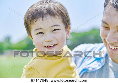 Japanese family in a city park View Large Photo Image Stock Photo - Japanese family in a city park. Fotosearch