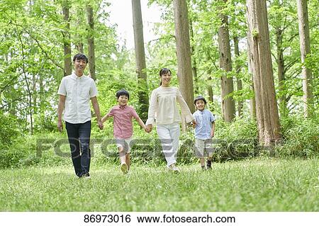 Japanese family in a city park View Large Photo Image Stock Photograph - Japanese family in a city park. Fotosearch